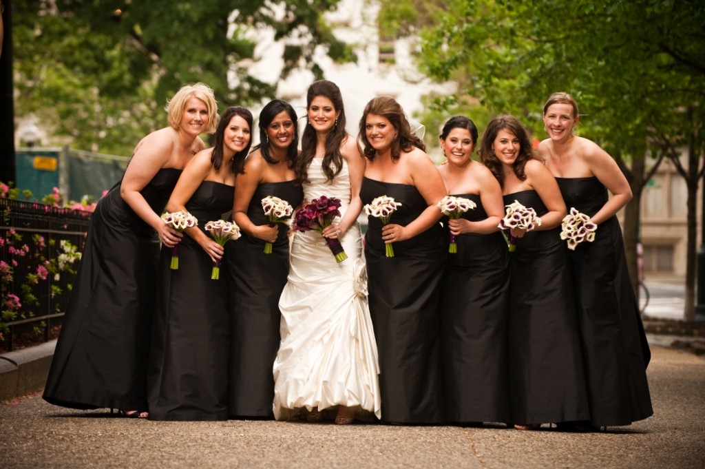 bridal party photos in philadelphia black bridesmaids gowns purple flowers for weddings