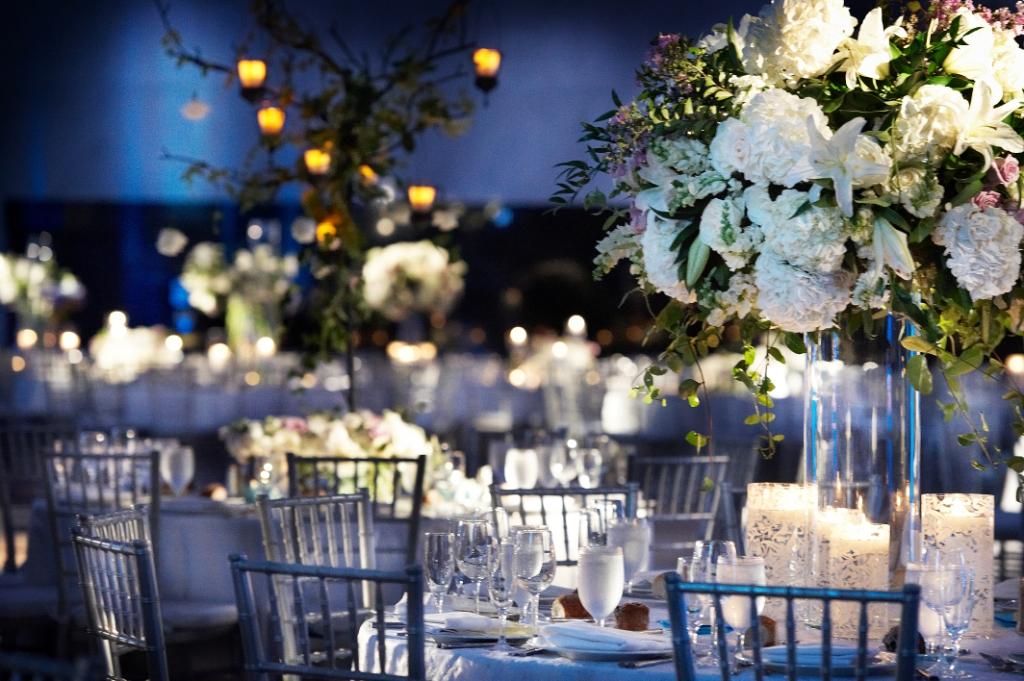 reception decor white flowers and blue lighting loews hotel evantine design