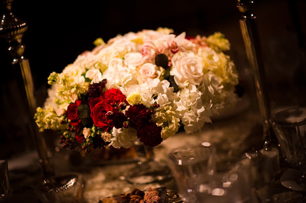 champagne, red and ivory floral centerpiece for high end philadelphia wedding evantine design