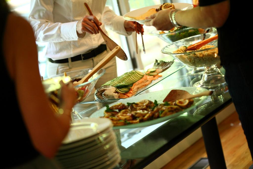 peter callahan caterings summer buffet with sweet corn grilled vegetables heirloom tomato salad grilled peach and arugula poached salmon