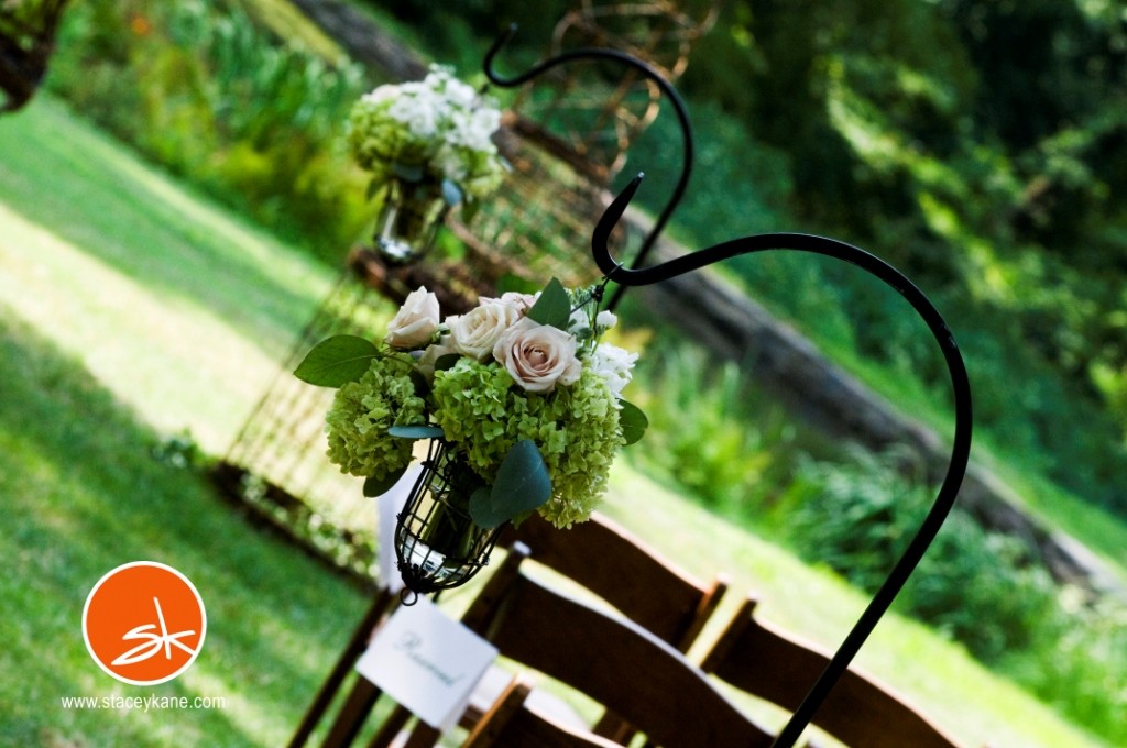 outdoor wedding ceremonies iron stanchions holding aisle flowers main line weddings philadelphia tented weddings appleford