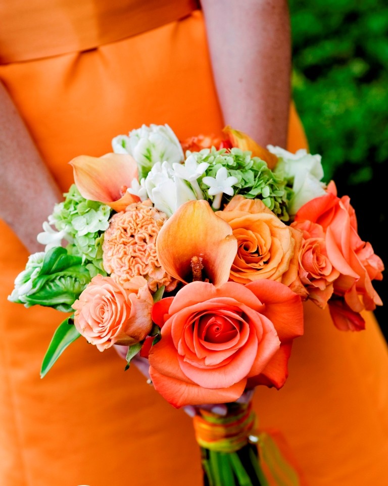 orange and tangerine bridal bouquet white stephanotis green tulips orange bridesmaids gowns