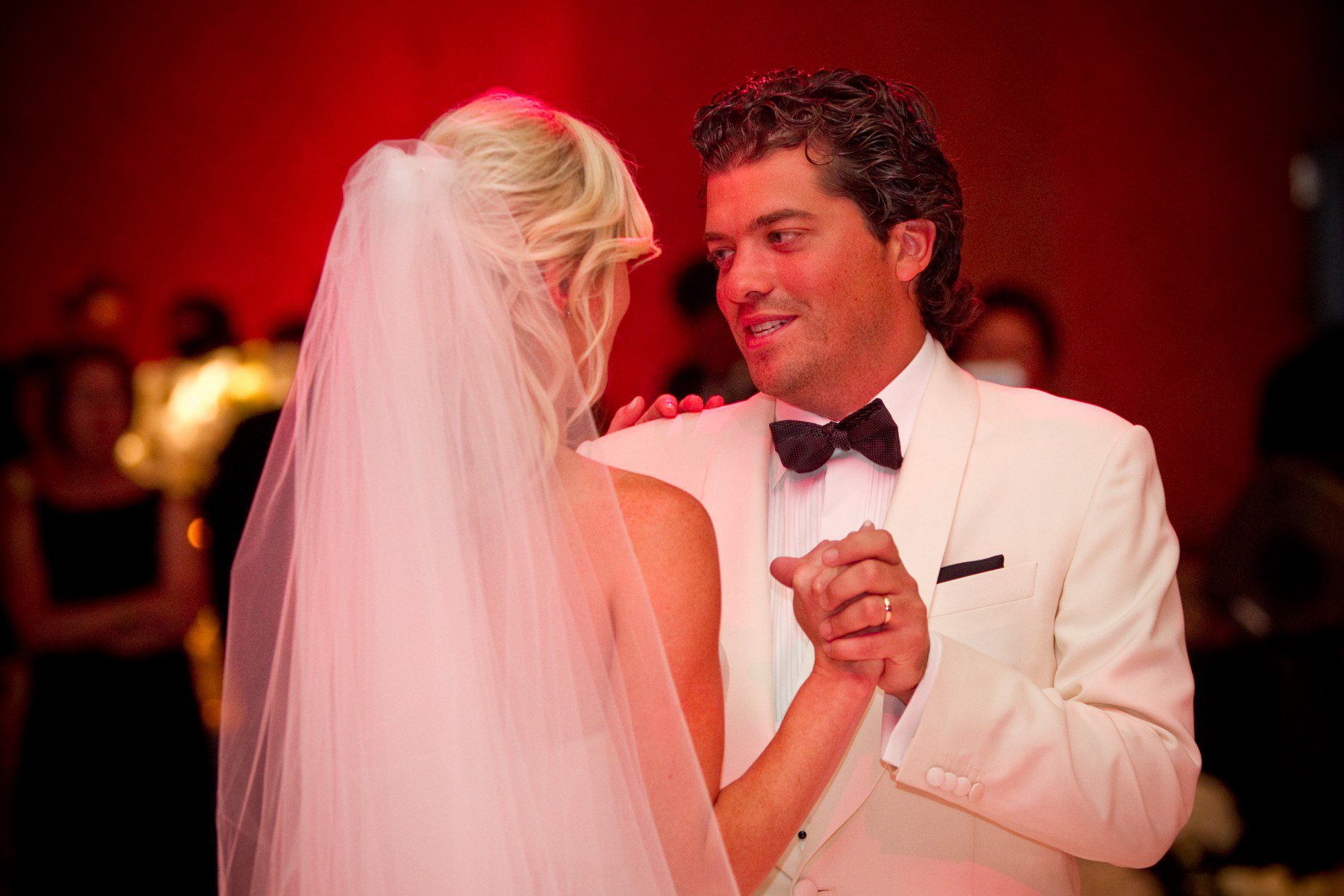 first-dance-groom-wearing-white-jacket-summer-weddings-luxury-hotels