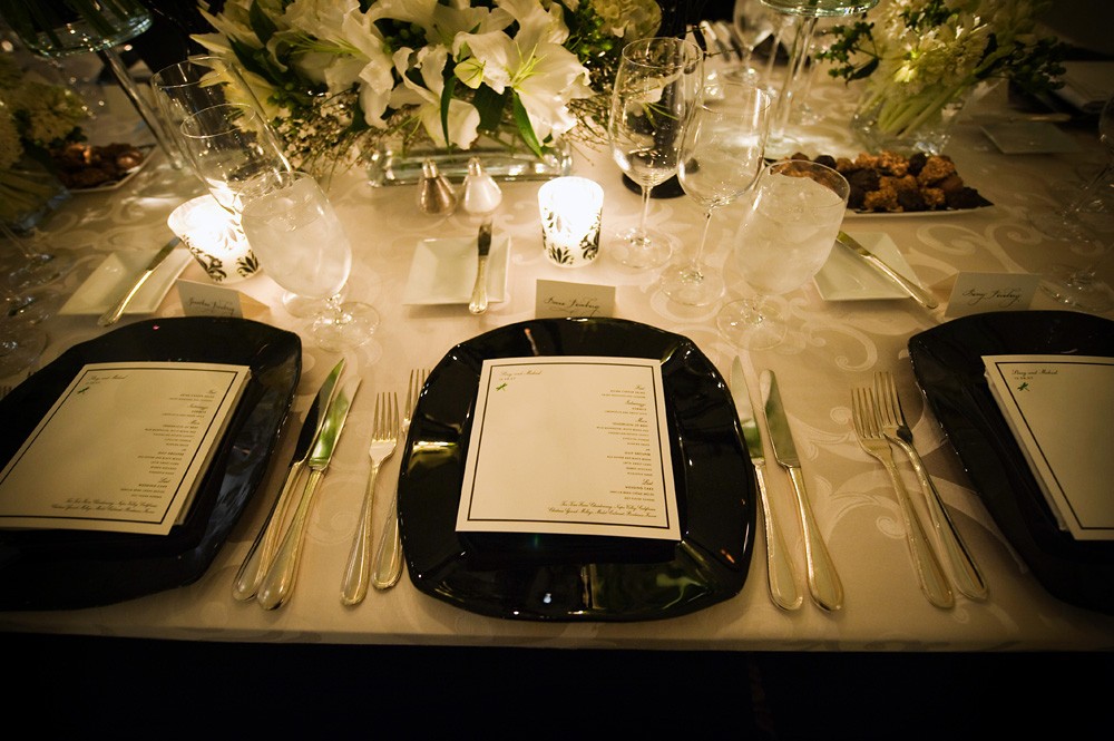 black chargers white upholstered tables ballroom weddings philadelphia