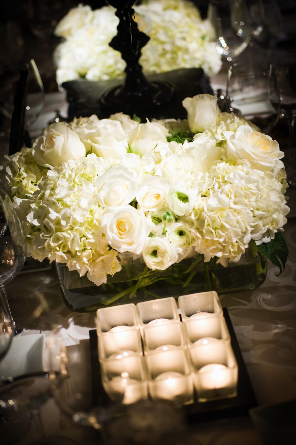 white hydrangea roses ranunculus wedding centerpieces