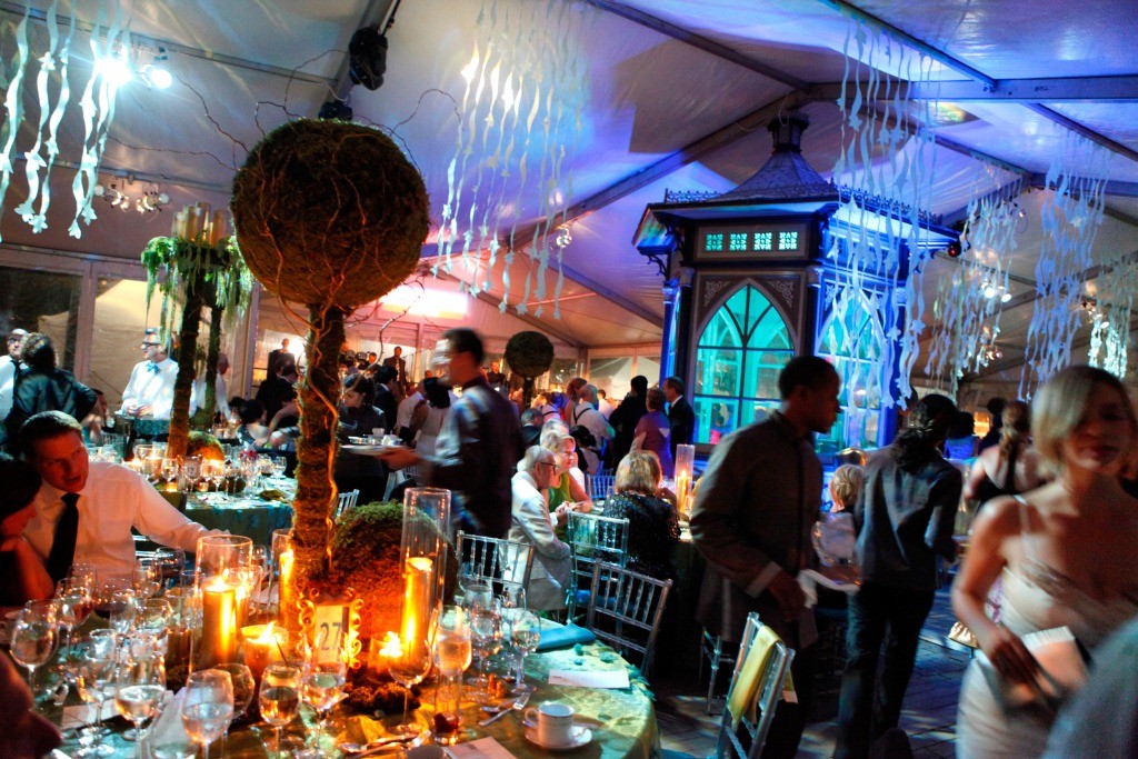 Dinner Tent with Gold Furniture Aqua Blue linens Moss Green Centerpeices Blue Lighting Eventions Productions
