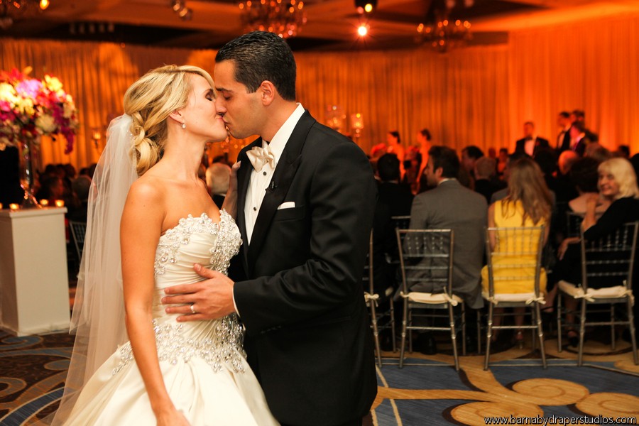 bride and groom kiss end of ceremony aisle four seasons hotel luxury weddings