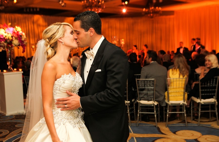 bride and groom kiss end of ceremony aisle four seasons hotel luxury weddings