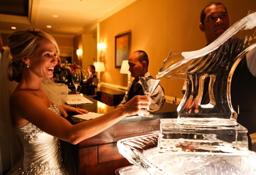 bride enjoying the ice luge martini bar four seasons hotel philadelphia luxury weddings