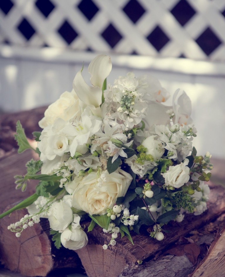 white country bridal bouquets snow berries ranunculus lily of the valley evantine design