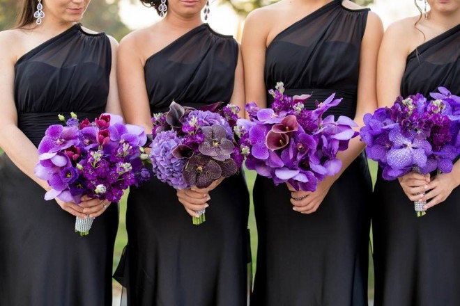 purple bridal bouquets orchids black bridesmaids dresses