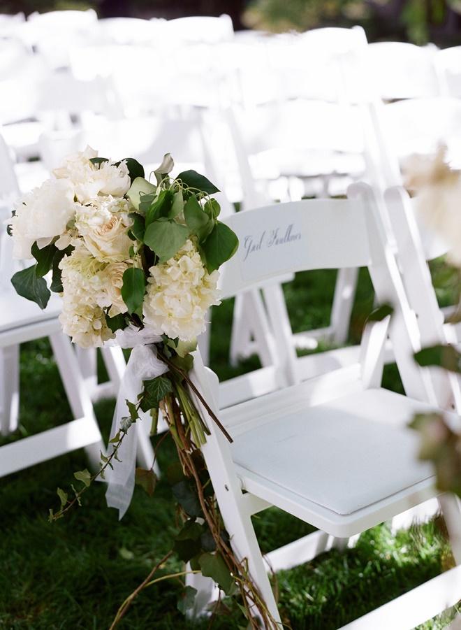 white garden chairs for wedding ceremonies with white garden pew arrangements evantine design