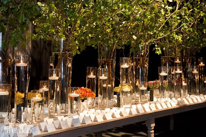 Floating candles and sparkling glass vases. Evantine Design.