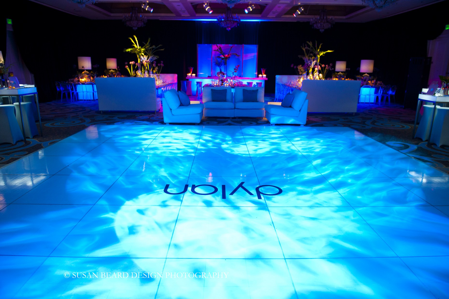 white dance floor with 1960s lighting effects blue lighting for parties evantine design