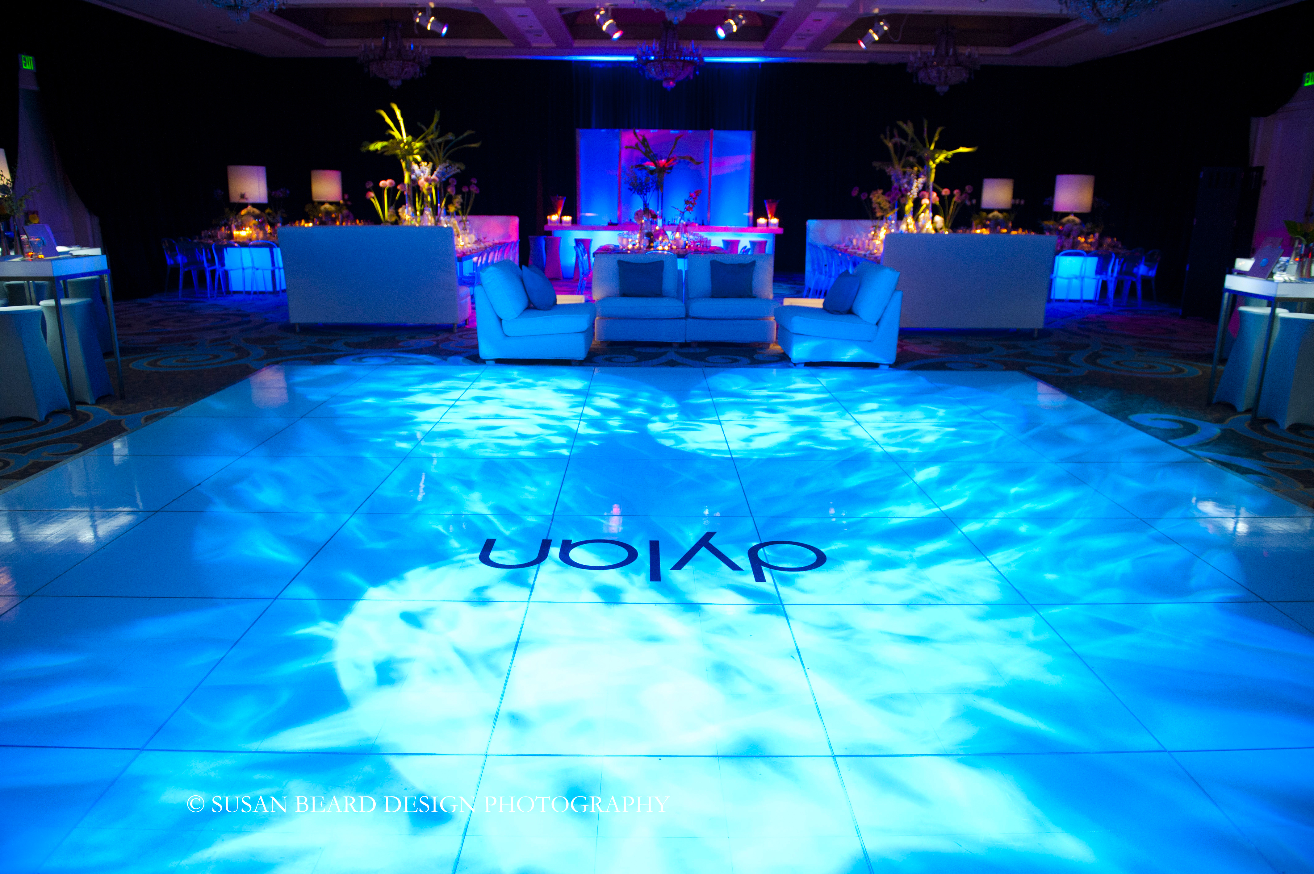 white dance floor with 1960s lighting effects blue lighting for parties evantine design