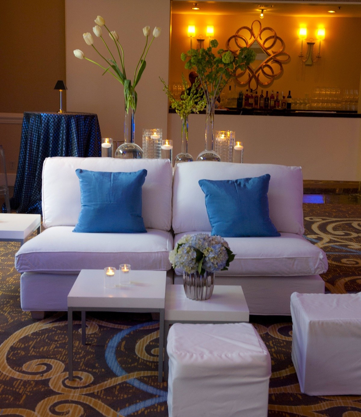 white lounge furniture with blue pillows for cocktail party four seasons hotel philadelphia evantine design