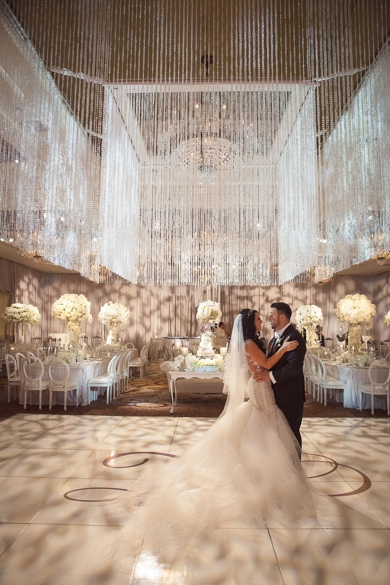 crystal chandelier over dance floor philly weddings evantine design luxury wedding planners
