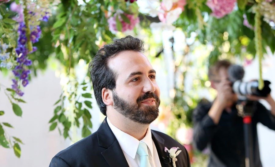 groom under chuppah philadelphia wedding planners barnes museum